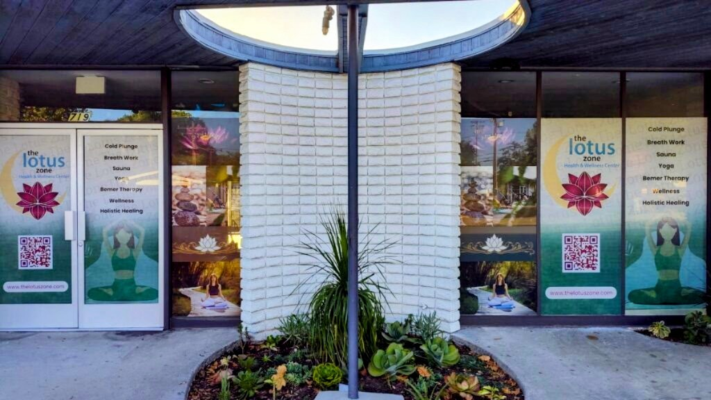 The Lotus Zone storefront in Fullerton with lotus signage and lush plants